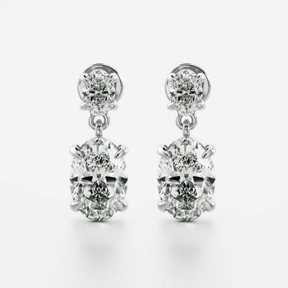 1.2 TCW Oval Cut Moissanite Dangles Earrings in Gold