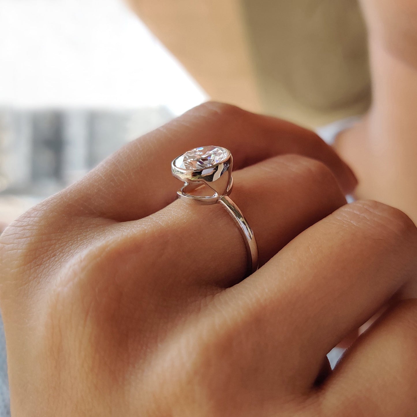 Oval Bezel Engagement Ring In White Gold