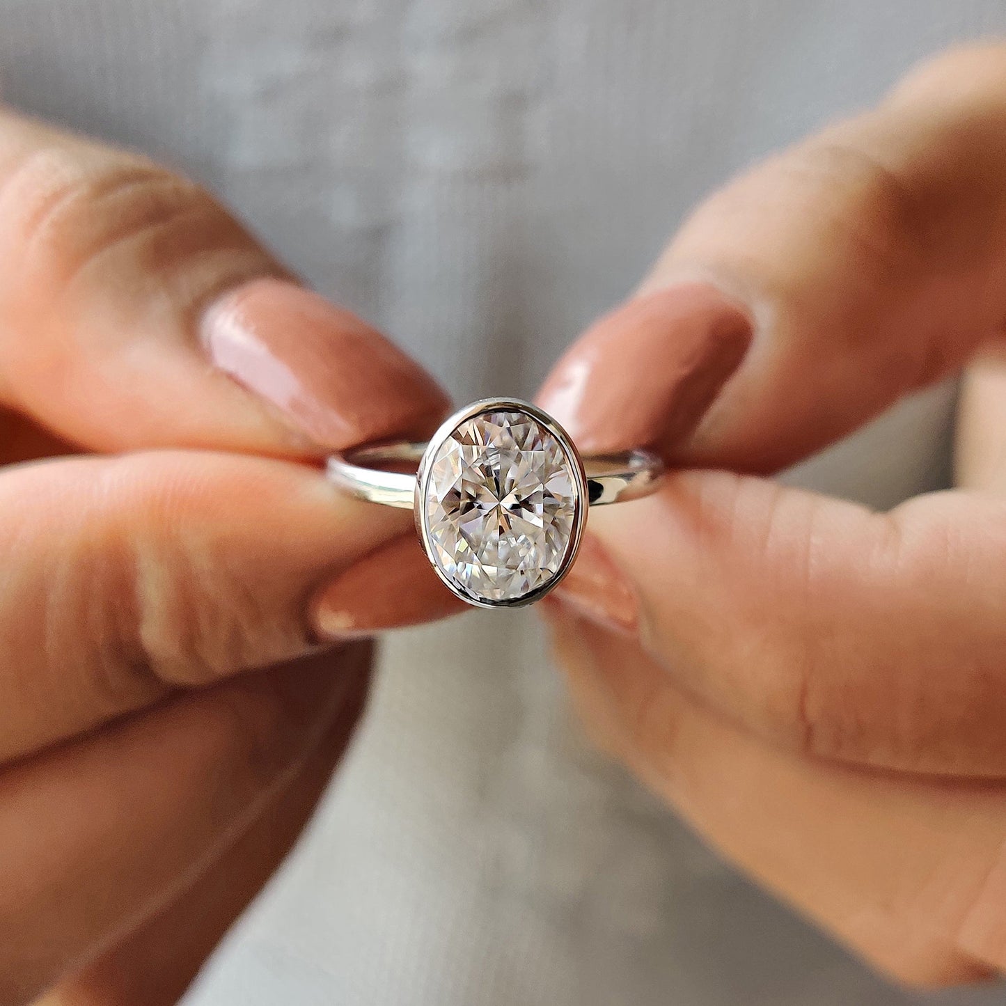Oval Bezel Engagement Ring In White Gold
