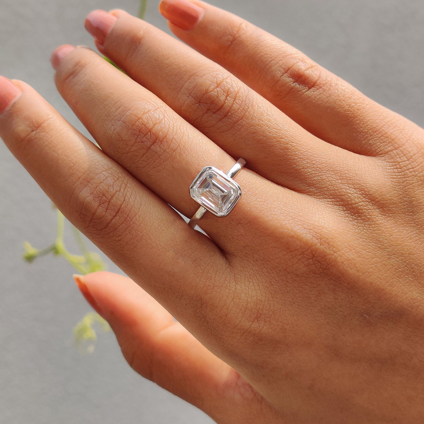 Emerald Engagement Ring With Bezel Setting