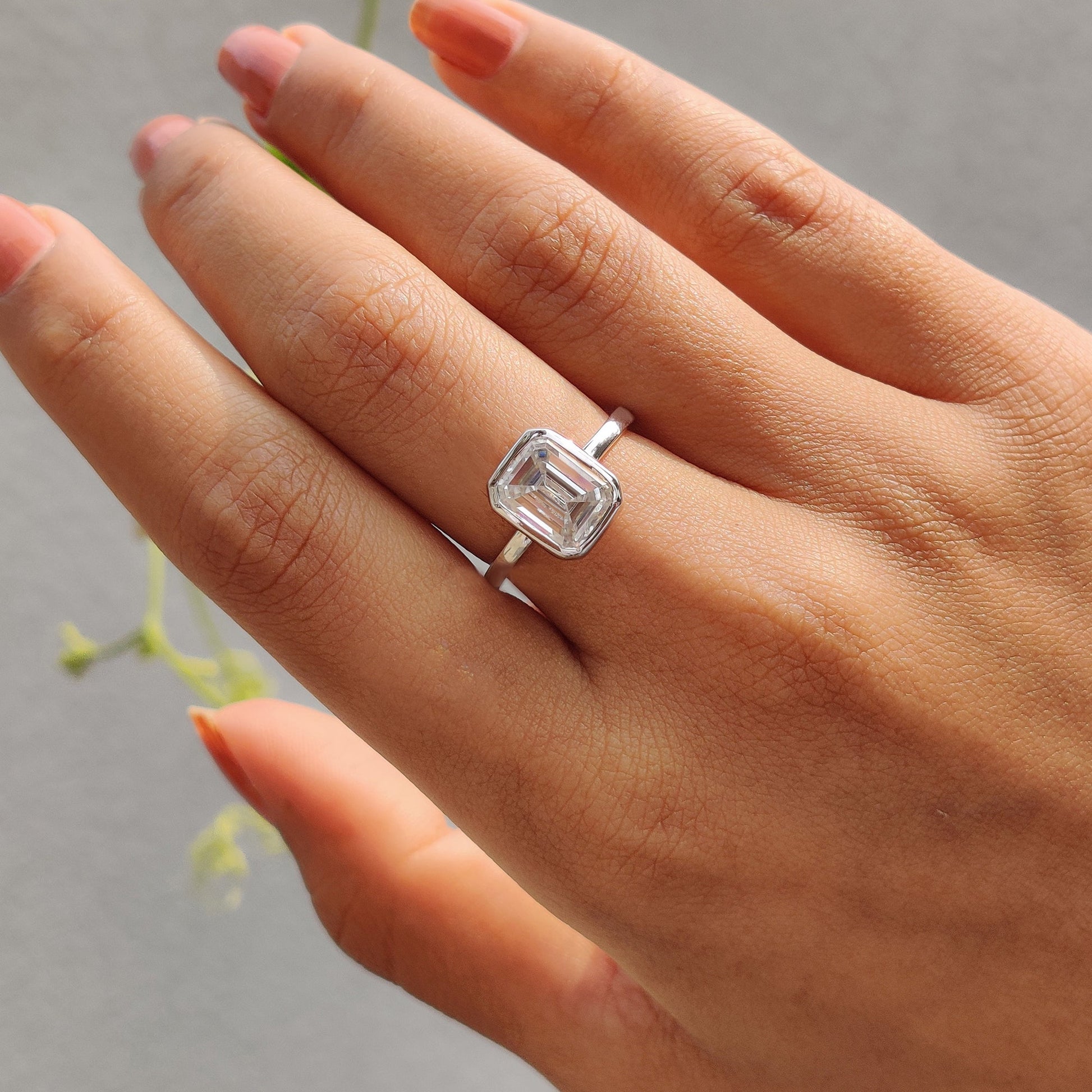 Emerald Engagement Ring With Bezel Setting