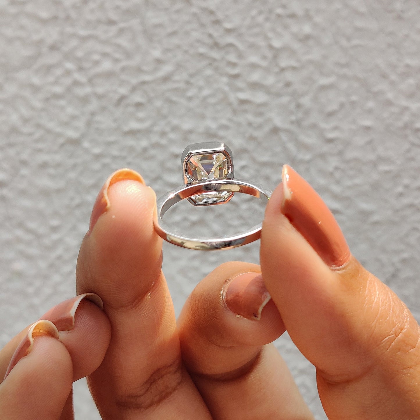 Emerald Engagement Ring With Bezel Setting