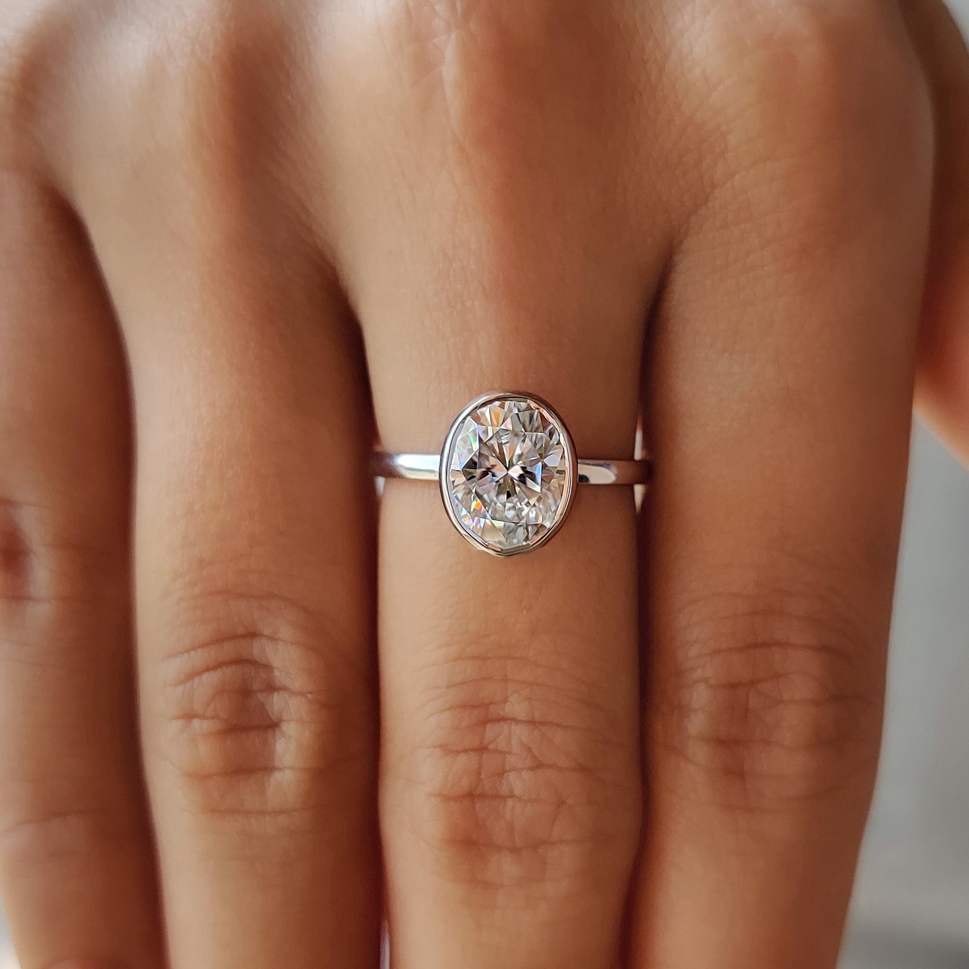 Oval Bezel Engagement Ring In White Gold